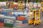ID 157 PORTS OF AUCKLAND, NZ - Straddle carriers operate among the container stacks on Ports of Aucklands' Axis Fergusson Container Termnal.